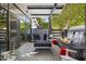 Outdoor patio with fireplace, water feature, and comfortable seating at 8614 E Berridge Ln, Scottsdale, AZ 85250