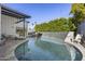 Relaxing pool area with a waterfall and plenty of seating at 8614 E Berridge Ln, Scottsdale, AZ 85250