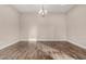 Formal dining room with hardwood floors and a modern chandelier at 911 E Tonto Pl, Chandler, AZ 85249