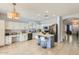 Kitchen with white cabinets, island, stainless steel appliances, and tile floor at 14449 W Evans Dr, Surprise, AZ 85379