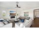 Open living room and dining area with modern decor and fireplace at 21066 W Granada Rd, Buckeye, AZ 85396