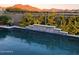 Stunning pool with mountain backdrop at sunset at 21066 W Granada Rd, Buckeye, AZ 85396