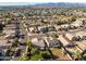 Aerial view of a residential neighborhood, showcasing homes with pools and solar panels at 15912 W Central St, Surprise, AZ 85374