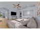 Spacious living room boasts a sectional sofa and a large TV at 15912 W Central St, Surprise, AZ 85374