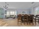 Sunlit dining room features a table, chairs, and adjacent sitting area at 15912 W Central St, Surprise, AZ 85374