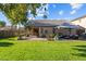 Backyard oasis featuring a covered patio and grassy area at 15912 W Central St, Surprise, AZ 85374