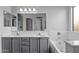 Double vanity bathroom with a large mirror and bathtub at 15912 W Central St, Surprise, AZ 85374