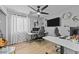 Home office with two desks, comfortable chairs, and plenty of natural light at 15912 W Central St, Surprise, AZ 85374