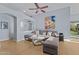 Spacious living room with L-shaped sectional sofa and access to backyard at 15912 W Central St, Surprise, AZ 85374