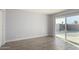 Bright bedroom with tile flooring and sliding glass door leading to backyard at 4302 N 80Th Ln, Phoenix, AZ 85033