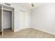 Bedroom with tile floors and access to another room at 4302 N 80Th Ln, Phoenix, AZ 85033