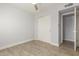 Bedroom with double door closet and wood floor at 4302 N 80Th Ln, Phoenix, AZ 85033