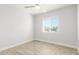 Simple bedroom with window and ceiling fan at 4302 N 80Th Ln, Phoenix, AZ 85033