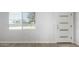 Bright and airy entryway with wood-look flooring and a modern door at 4302 N 80Th Ln, Phoenix, AZ 85033