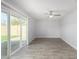 Bright living room featuring tile floors and sliding glass doors at 4302 N 80Th Ln, Phoenix, AZ 85033