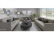Living room with two sofas, a coffee table, and stylish wall art at 4302 N 80Th Ln, Phoenix, AZ 85033