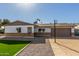 Updated single-story home with a 2-car garage, artificial turf, and basketball hoop at 4302 N 80Th Ln, Phoenix, AZ 85033