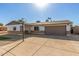 Recently updated home with artificial turf, driveway, and basketball hoop at 4302 N 80Th Ln, Phoenix, AZ 85033