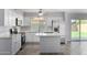 Updated kitchen with white cabinets and quartz countertops at 4302 N 80Th Ln, Phoenix, AZ 85033