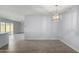 Bright dining room with tile floors and view to living area at 4302 N 80Th Ln, Phoenix, AZ 85033