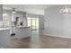 Modern kitchen with island and view to living room at 4302 N 80Th Ln, Phoenix, AZ 85033