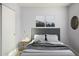 Cozy bedroom with a double bed and side table at 4302 N 80Th Ln, Phoenix, AZ 85033