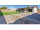 Backyard with artificial turf and gravel pathways at 4302 N 80Th Ln, Phoenix, AZ 85033