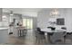 Open concept kitchen with island and dining area at 4302 N 80Th Ln, Phoenix, AZ 85033