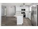 Renovated kitchen featuring white cabinets, quartz countertops, and stainless steel appliances at 4302 N 80Th Ln, Phoenix, AZ 85033