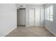 Bedroom with tile floor, double door closet and window with blinds at 4302 N 80Th Ln, Phoenix, AZ 85033