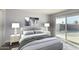 Bright bedroom with sliding door access to backyard at 4302 N 80Th Ln, Phoenix, AZ 85033