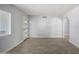 Spacious entryway with an arched hallway opening and wood-look tile flooring at 4302 N 80Th Ln, Phoenix, AZ 85033