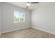 Bedroom with tile flooring, ceiling fan and window with blinds at 4302 N 80Th Ln, Phoenix, AZ 85033