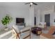 Living room with two armchairs, coffee table, and a view to kitchen at 6560 N Loma Ct, Casa Grande, AZ 85194