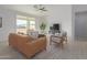 Living area showcasing a comfortable couch and natural light at 6560 N Loma Ct, Casa Grande, AZ 85194