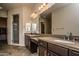 Double vanity bathroom with a large mirror and a walk-in shower at 27000 N Alma School Pkwy # 2004, Scottsdale, AZ 85262