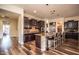 Gourmet kitchen with granite island and dark cabinetry at 27000 N Alma School Pkwy # 2004, Scottsdale, AZ 85262
