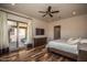 Spacious bedroom with wood floors and access to a private balcony at 27000 N Alma School Pkwy # 2004, Scottsdale, AZ 85262