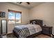 Cozy bedroom with wood floors and a large window at 27000 N Alma School Pkwy # 2004, Scottsdale, AZ 85262