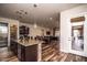 Open kitchen with island and views to the living room at 27000 N Alma School Pkwy # 2004, Scottsdale, AZ 85262