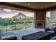Covered patio with mountain views and fireplace at 27000 N Alma School Pkwy # 2004, Scottsdale, AZ 85262