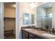 Bathroom with double sinks and a large walk-in closet at 27000 N Alma School Pkwy # 2004, Scottsdale, AZ 85262