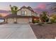 Two-story house with a three-car garage and landscaped front yard at 16640 N 54Th St, Scottsdale, AZ 85254