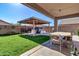 Backyard patio features a covered seating area at 11107 E Wier Ave, Mesa, AZ 85208