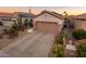 Single-story home with landscaped yard and two-car garage at 15877 W Arrowhead Dr, Surprise, AZ 85374