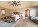 Large main bedroom with wood flooring and ensuite bathroom access at 15406 E Cavedale Dr, Scottsdale, AZ 85262