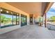 Covered patio with stone accents and sliding glass doors at 15406 E Cavedale Dr, Scottsdale, AZ 85262