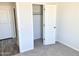 Bright bedroom with spacious closet and carpet flooring at 8572 W Raven Dr, Arizona City, AZ 85123