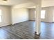 Spacious living room with hardwood floors and large windows at 201 S Apache Ave, Eloy, AZ 85131
