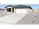 One-story home with light beige exterior and gravel yard at 201 S Apache Ave, Eloy, AZ 85131